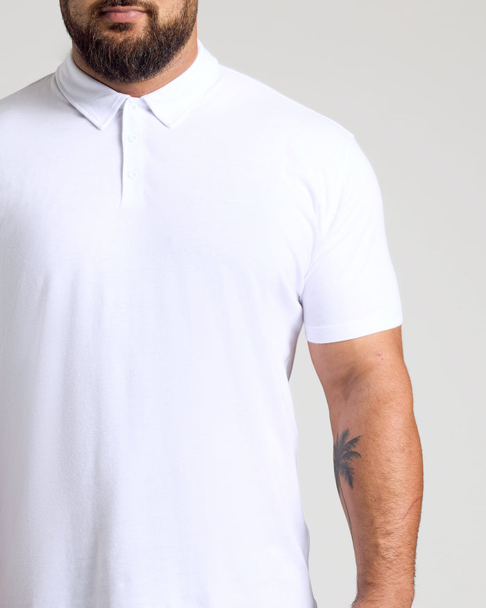 Man wearing The Light Indigo Short Sleeve Polo from 3-Pack.