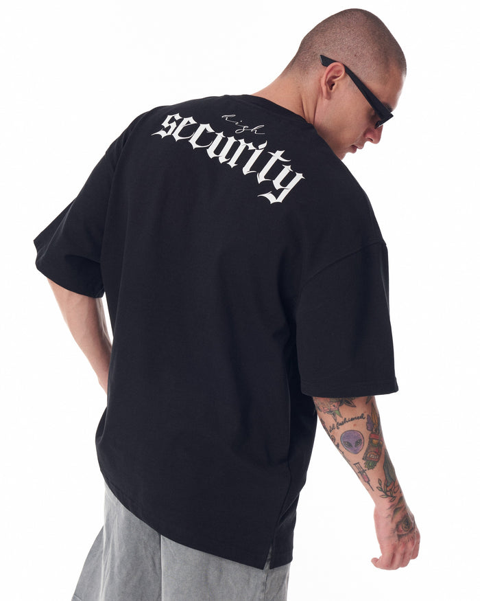 Martin Valen oversized black men's T-shirt angled rear view showing white 'security' screen print across upper back