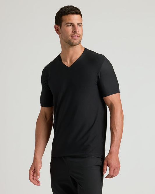 Young man in Black Active V-Neck and matching pants.
