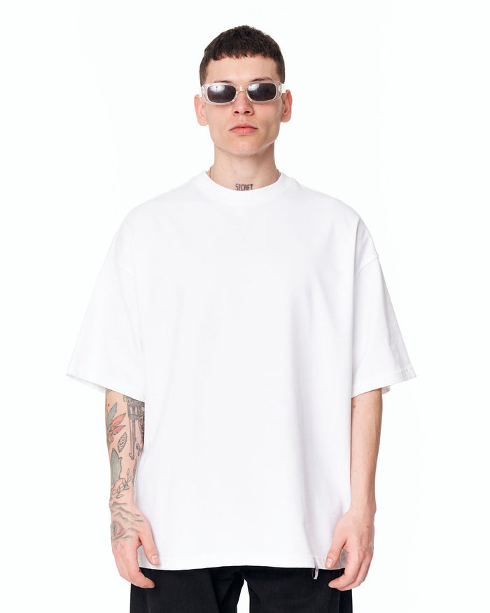 Follow The Stream Oversized White T-Shirt styled with light washed denim