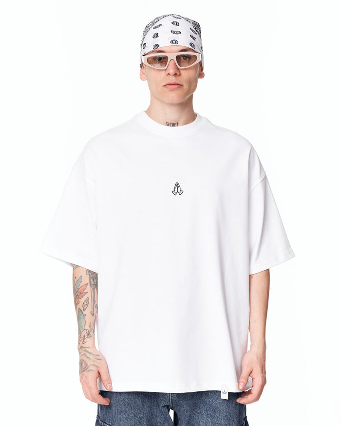 Namaste Streetwear Oversized White T-Shirt styled with blue denim jeans