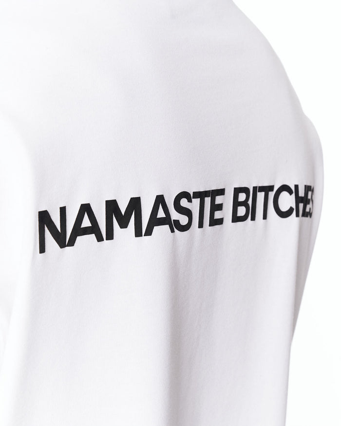 Namaste Streetwear Oversized White T-Shirt paired with washed denim jeans