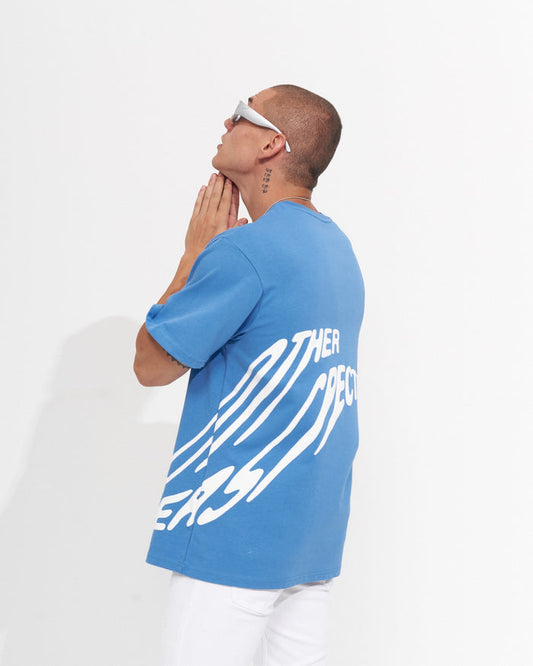 Martin Valen 'Perspective' oversized men's blue T-shirt, rear-side view showing white puff print and crew neckline