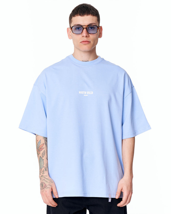 Martin Valen "Slogan" oversized blue men's T‑shirt front view showing wide fit and small centre chest logo
