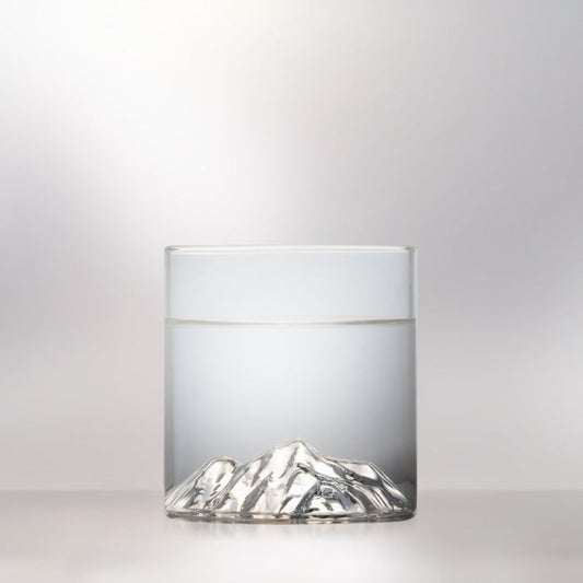 Glass tumbler with 3D relief of Pyramid Mountain photographed on a white background for product display