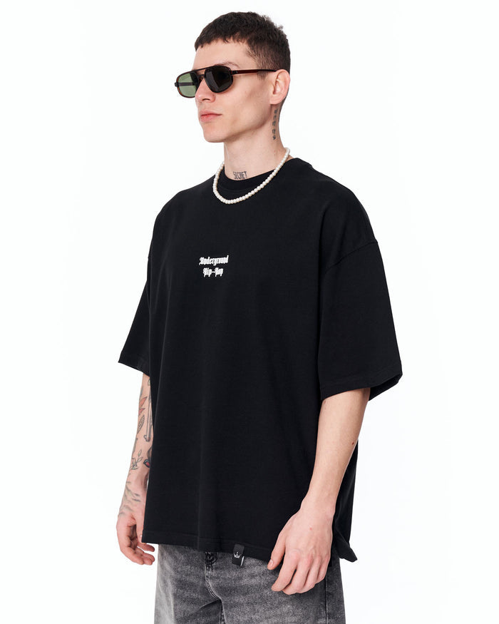 Underground Hip Hop Oversized Black T-Shirt styled with grey washed denim
